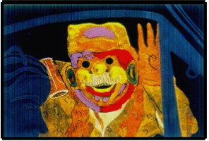 FIGURE 44: DUNCAN LAURIE. “MARDI GRAS IN VENEZUELA”. PAINT AND GOLD LEAF ON CARVED GLASS